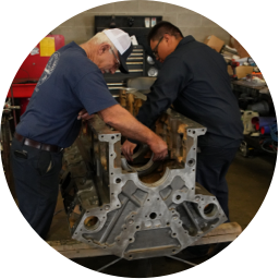 Devall Diesel technicians working on an engine as part of their 24/7 live customer service guarantee