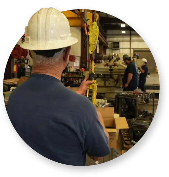 Devall Diesel warehouse workers loading equipment onto a crane