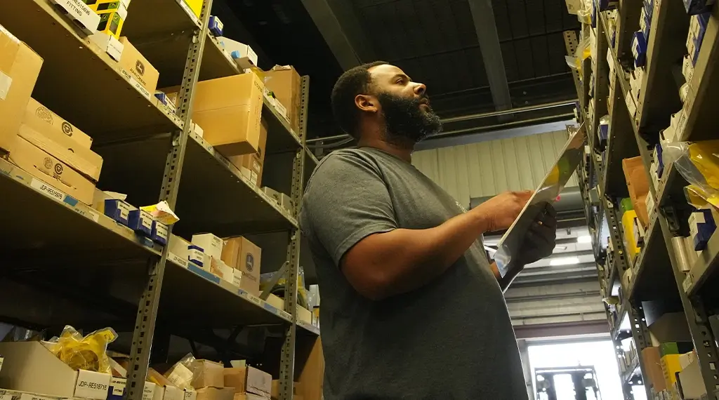A Devall Diesel warehouse worker cataloging parts