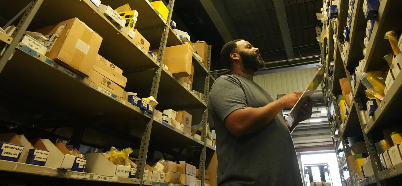 A Devall Diesel warehouse worker cataloging parts