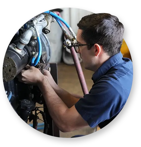 A Devall Diesel technician tightening screws on a diesel