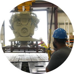 A Deval Diesel technician preparing a diesel engine to be shipped across the nation